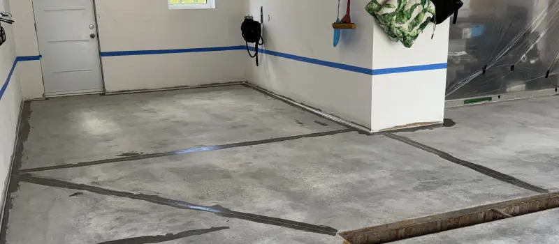 Ground garage slab with repaired cracks, before the finish