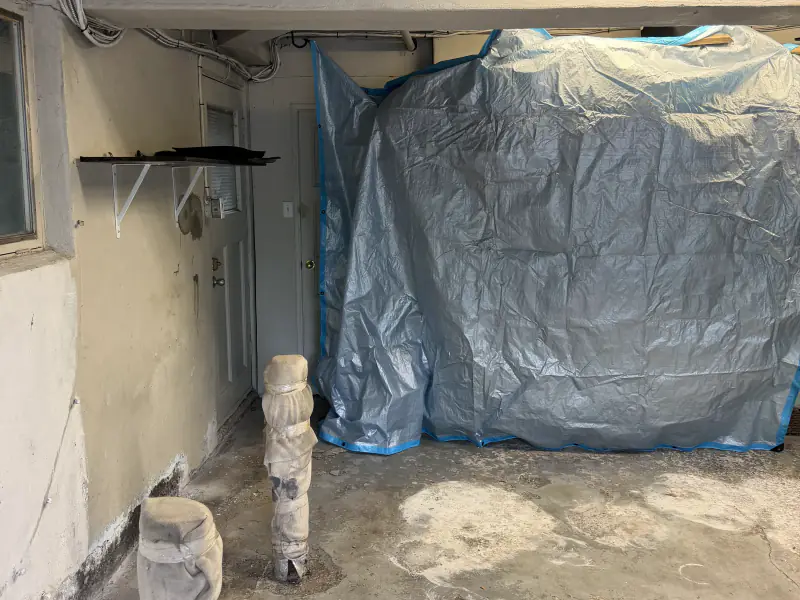 Bare, stained concrete slab before the work